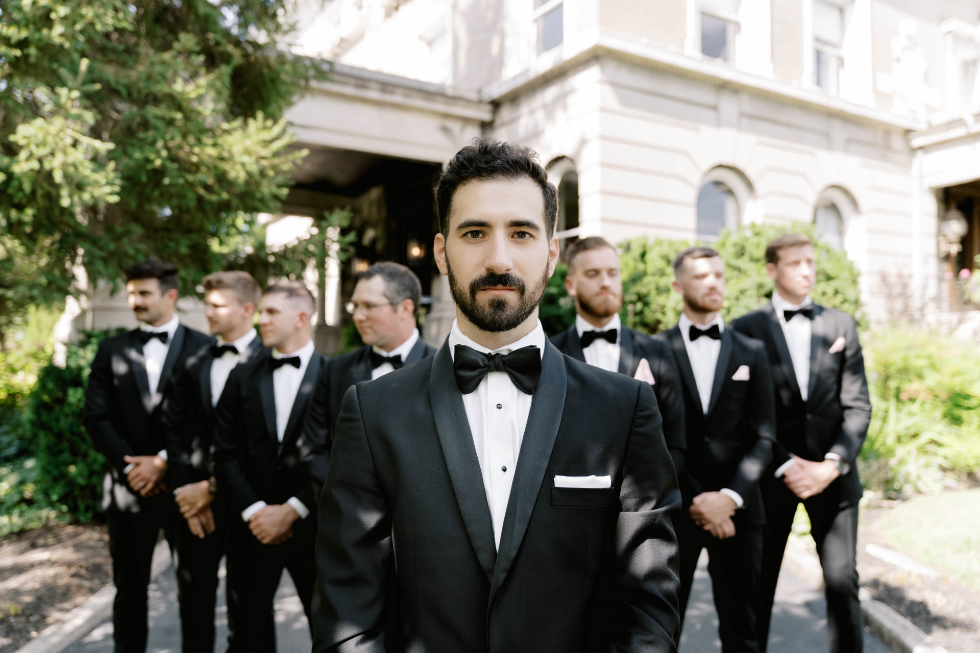Groomsmen at the mansion entrance
