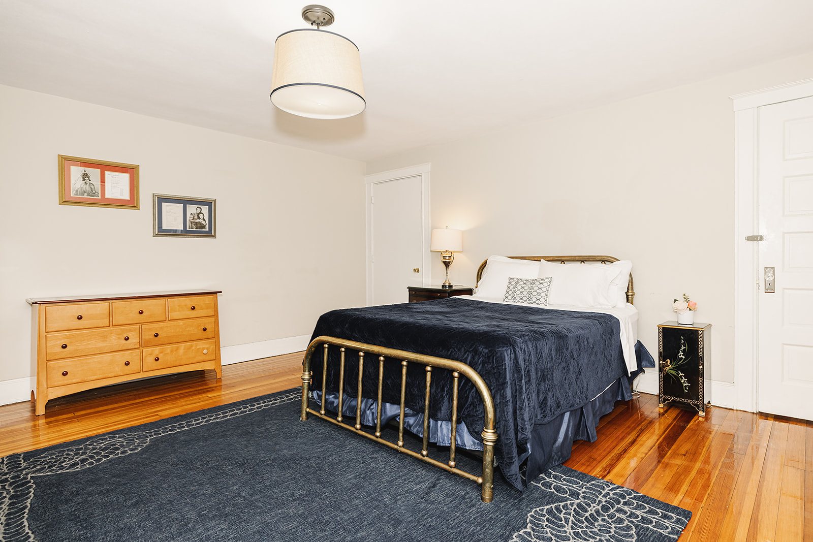 The Mansion Suite — Bedroom with brass bed